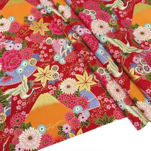 Red Japanese fabric with floral motif, birds, fans and Mount Fuji