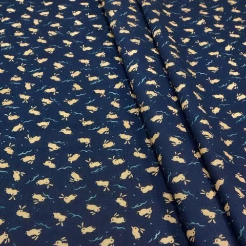 Japanese dark blue cotton fabric with beige bunny motif