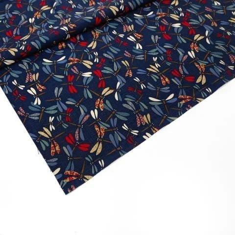 Dark blue Japanese fabric decorated with a multitude of multicolored dragonflies