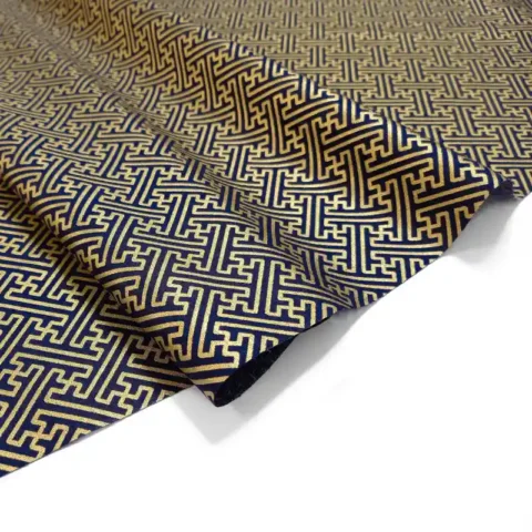 Black fabric with gold geometric print