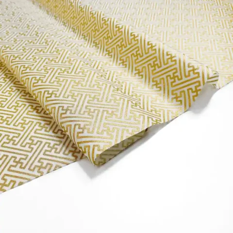 White fabric with gold geometric print