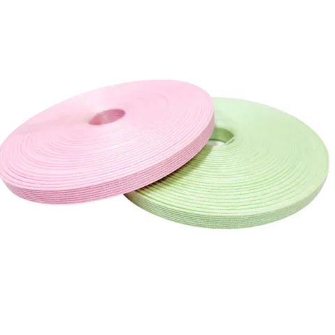 Pink and green laminated paper roll